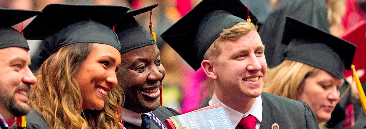 Students smiling at a Commencement Ceremony